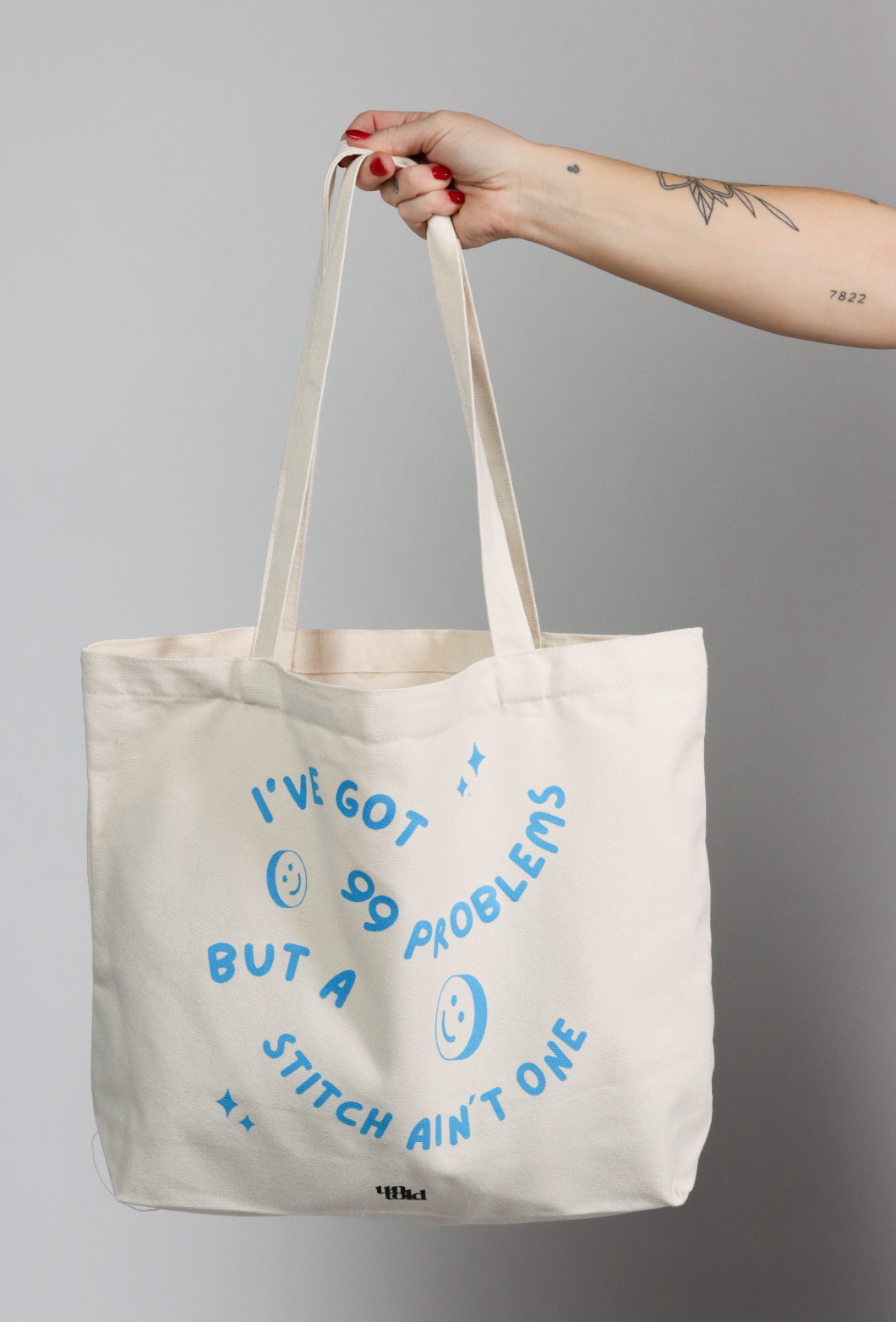 Un-told tote bag / 99 problems, but a stitch aint one